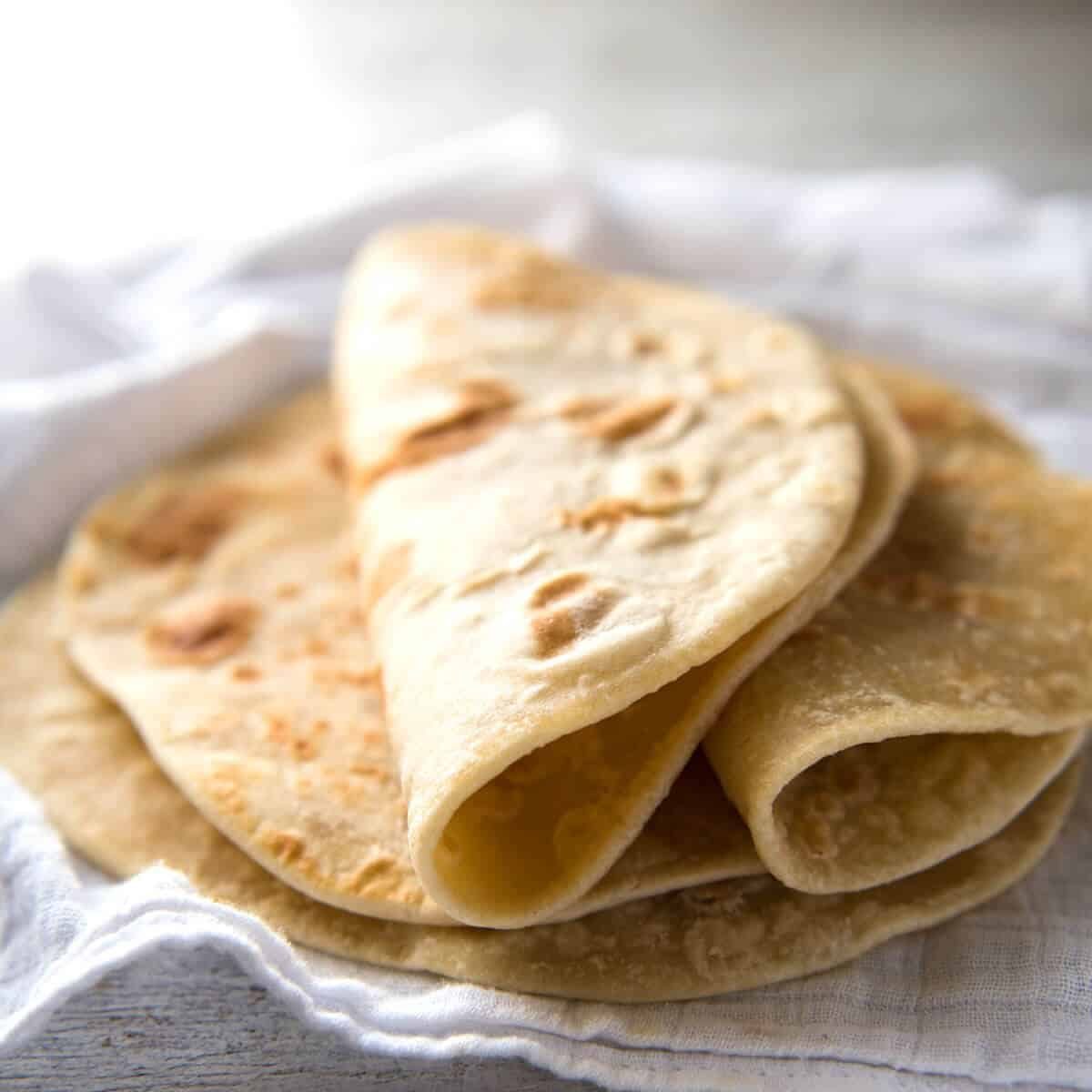This flatbread recipe is made without yeast, yet is soft and pliable and wonderfully moist. recipetineats.com