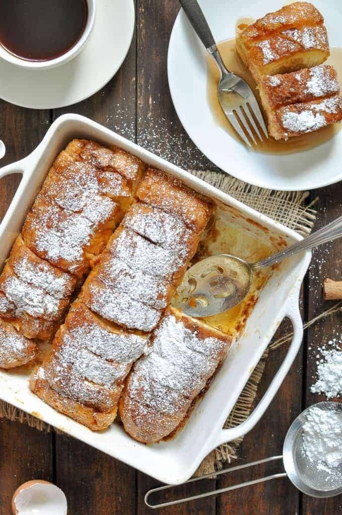 Hasselback Baked French Toast in a baking dish, hot out of the oven and ready to be served.