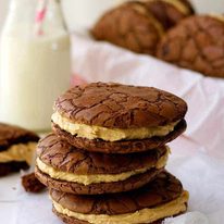 Brownie Cookie Sandwich with Peanut butter Frosting - fudgy, moist cookies that taste just like brownies filled with a fluffy peanut butter frosting.