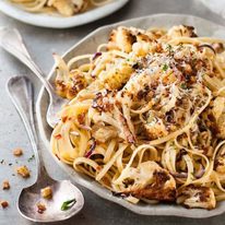 Garlic Butter Cauliflower Pasta with Pangritata toasted breadcrumbs on a plate, ready to be served.