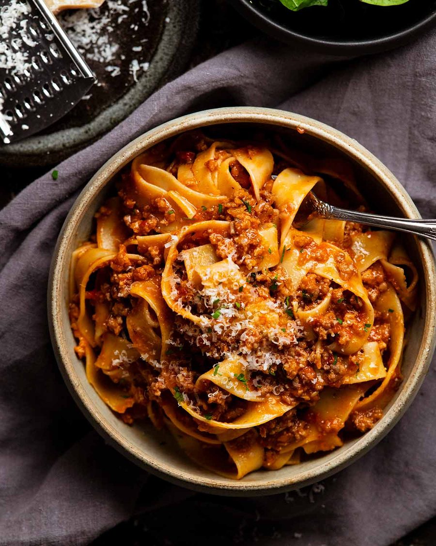 Sausage ragu pasta sauce with pappardelle in a bowl ready to be eaten