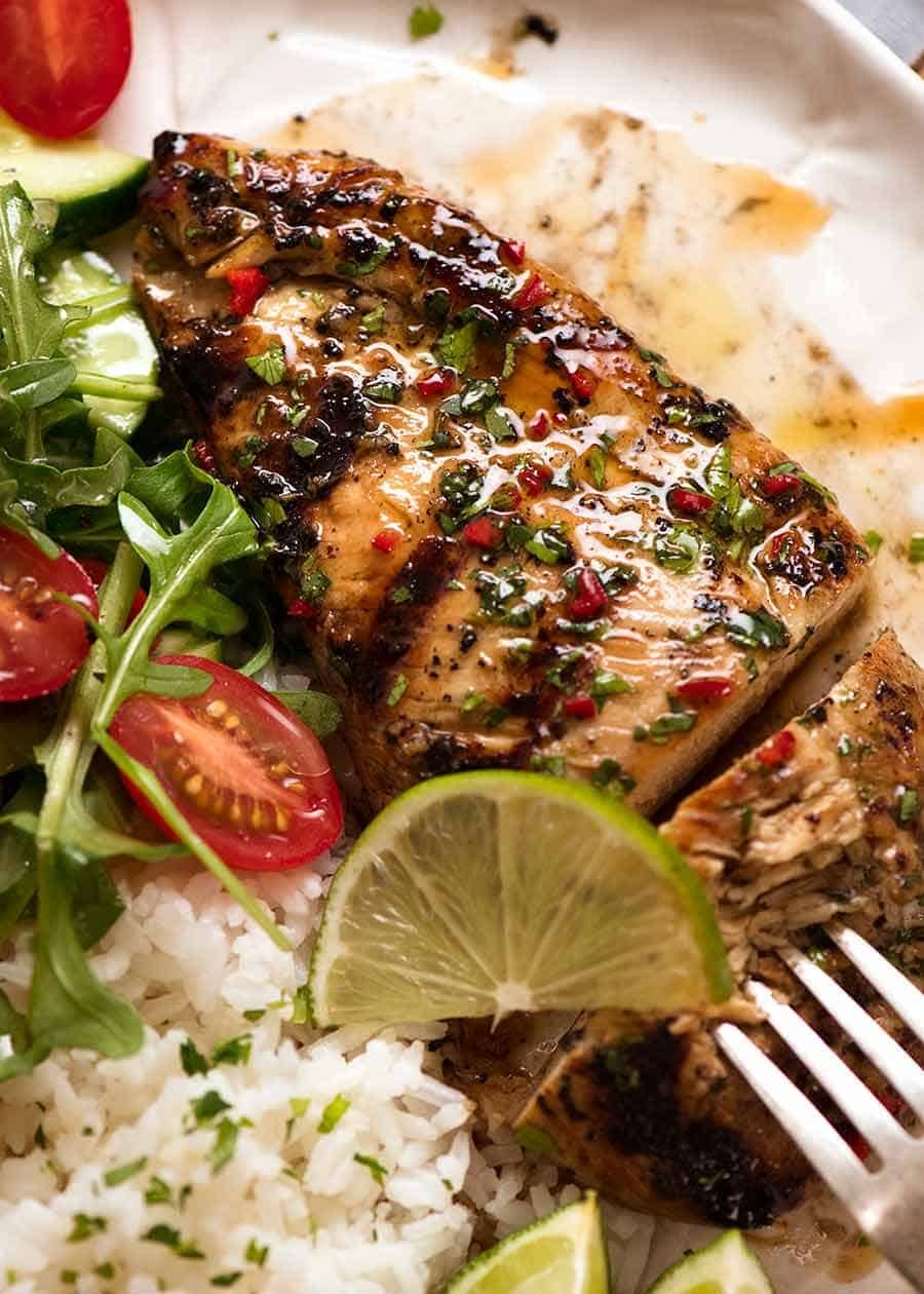 Cilantro Lime Chicken on a plate with a side of coconut lime rice and a garden salad