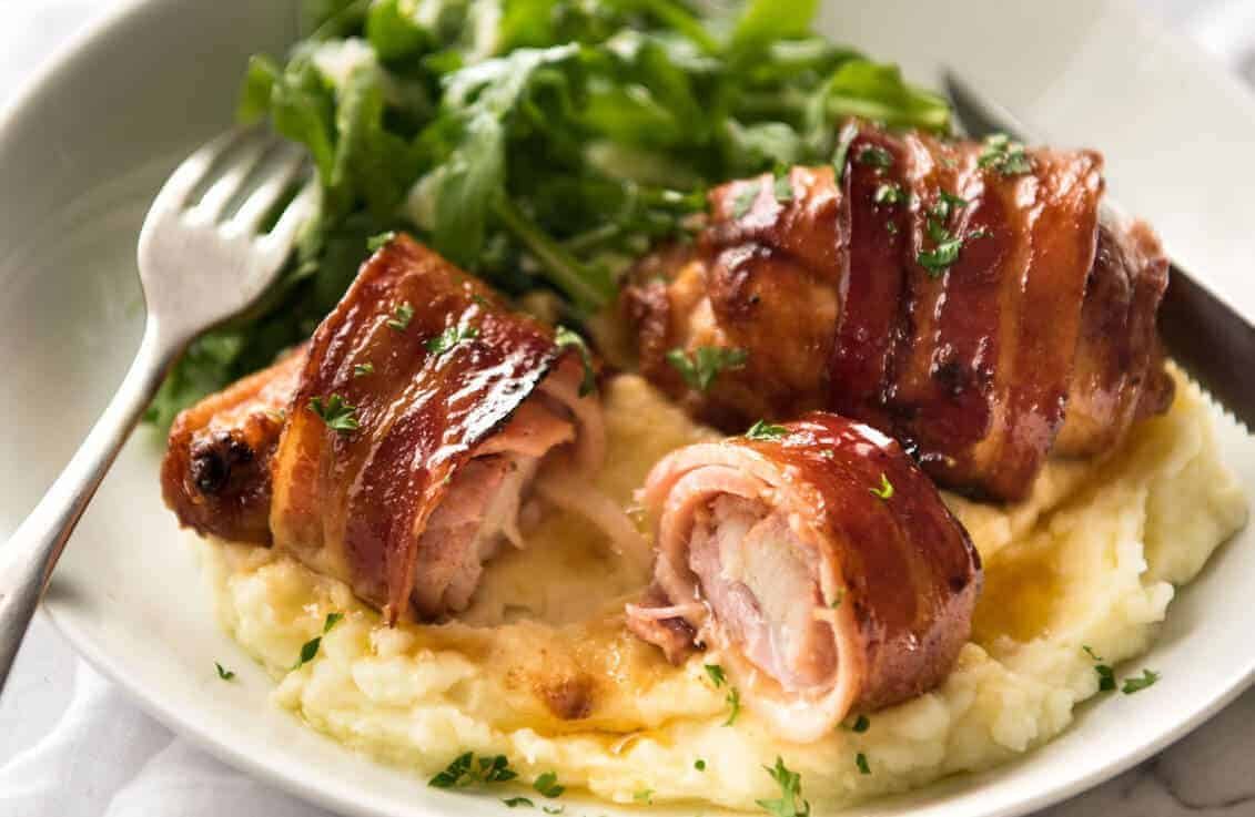 Bacon Wrapped Chicken - A spectacular way to dress up chicken with just a few simple ingredients! Brown sugar is the key to creating a gorgeous glaze on the bacon. recipetineats.com