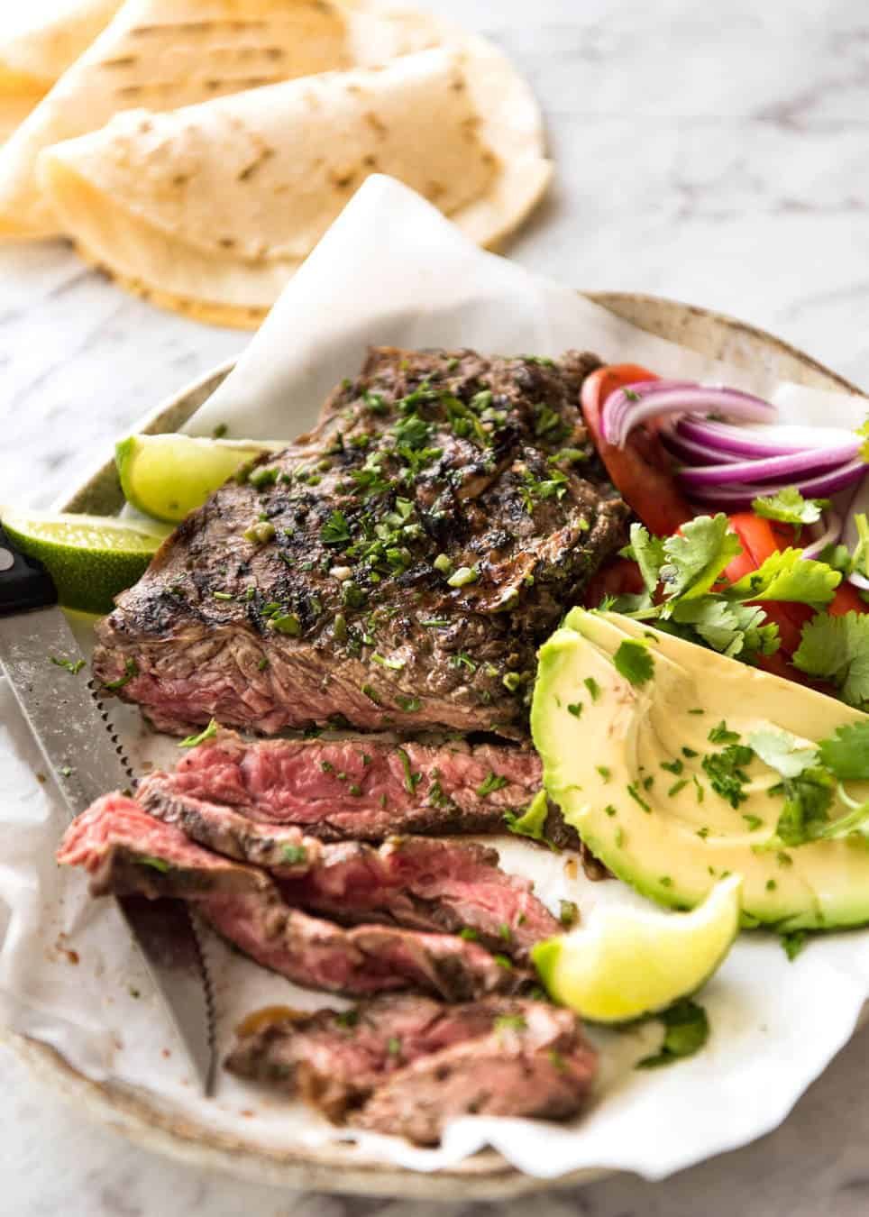 Carne Asada grilled to perfect, pink inside, marinated in a citrusy, garlicky authentic Carne Asada marinade. recipetineats.com