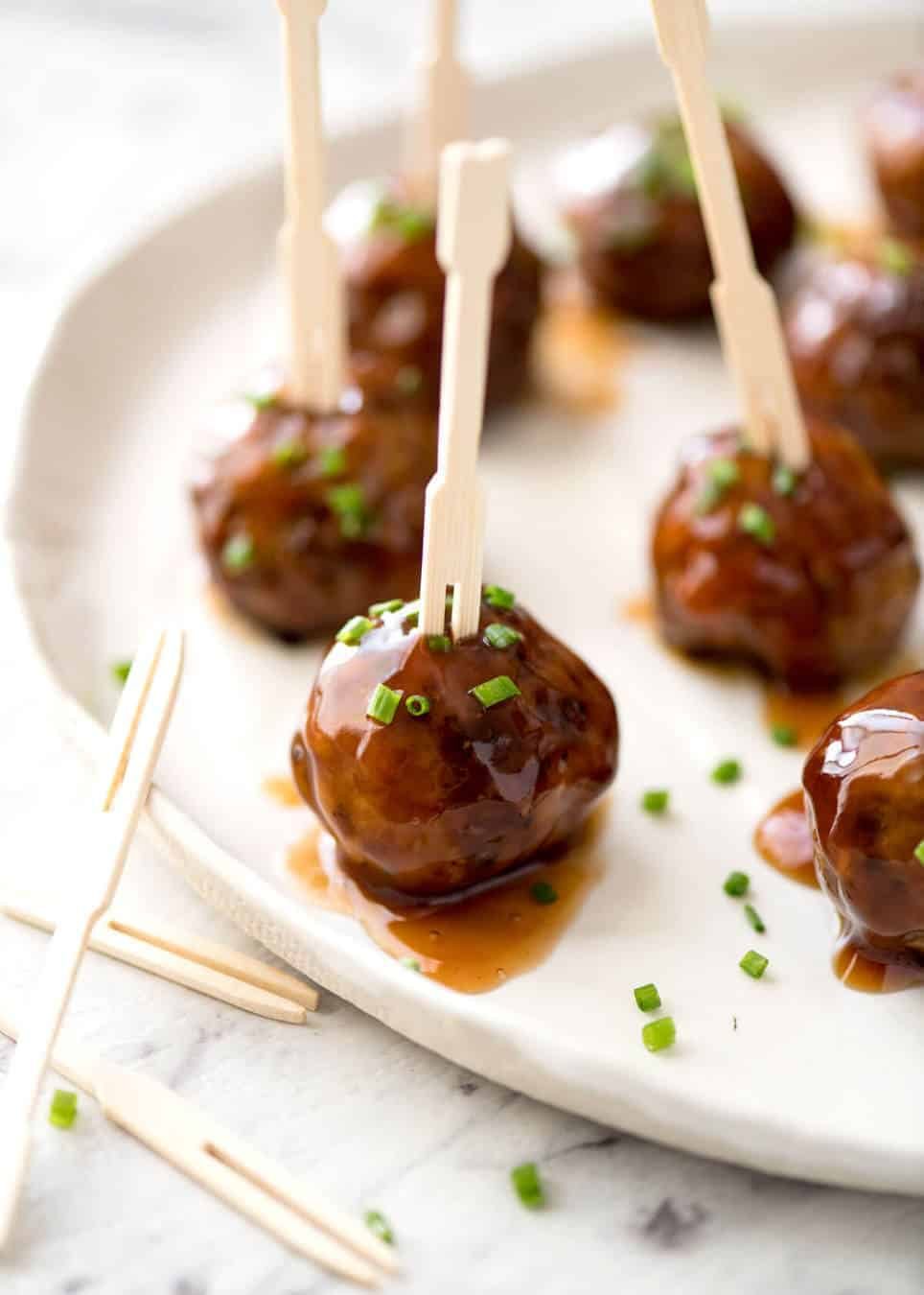 Plump, juicy and soft, these Party Cocktail Meatballs are baked and served with a fabulous Sweet & Sour Dipping Sauce that's super quick to make. Great make ahead for parties! www.recipetineats.com