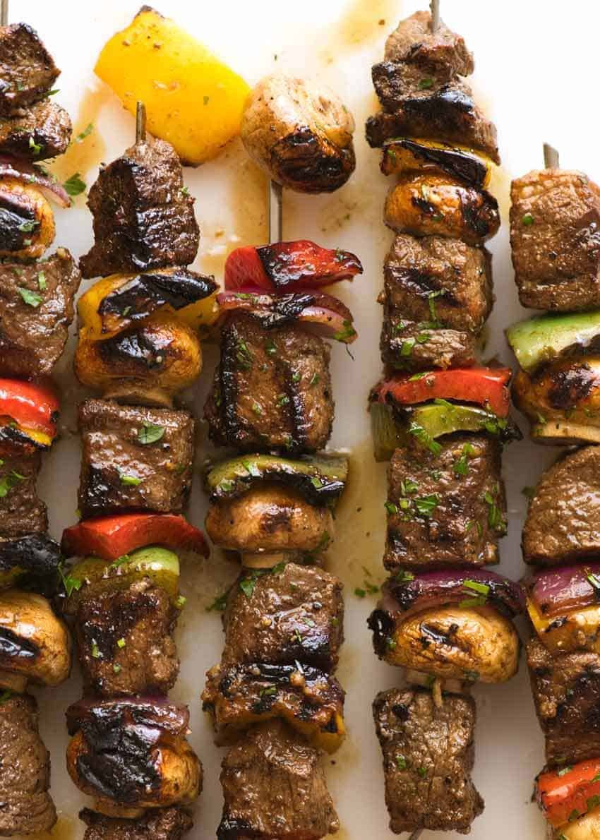 Overhead photo of Marinated Beef Kabobs with bell peppers, mushrooms and red onion