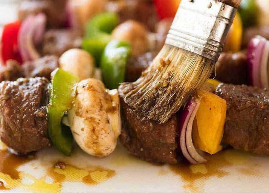 Brushing Beef Kabobs with marinade