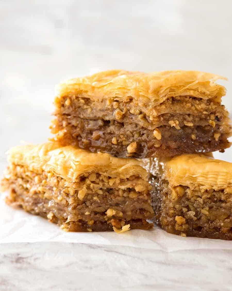 Close up of a stack of Baklava, dripping with honey syrup