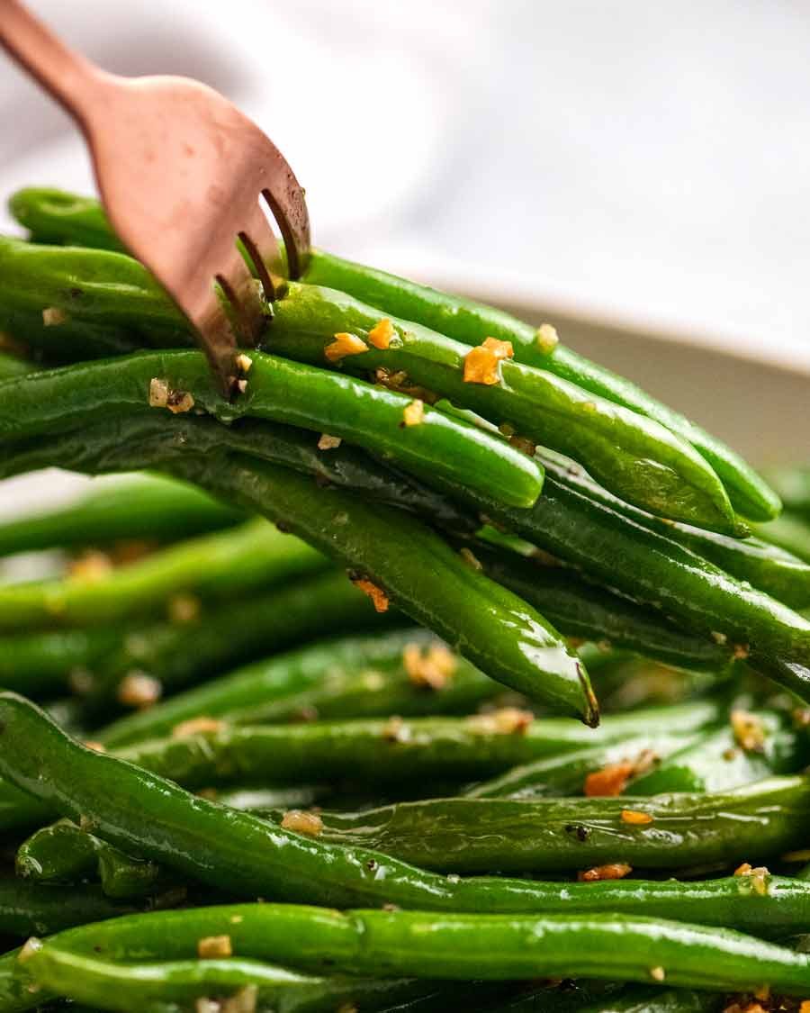 Fork picking up Garlic Sautéed Green Beans